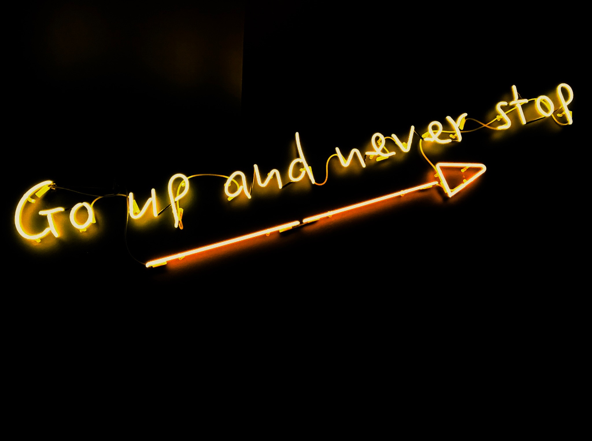 Go up and never stop neon sign