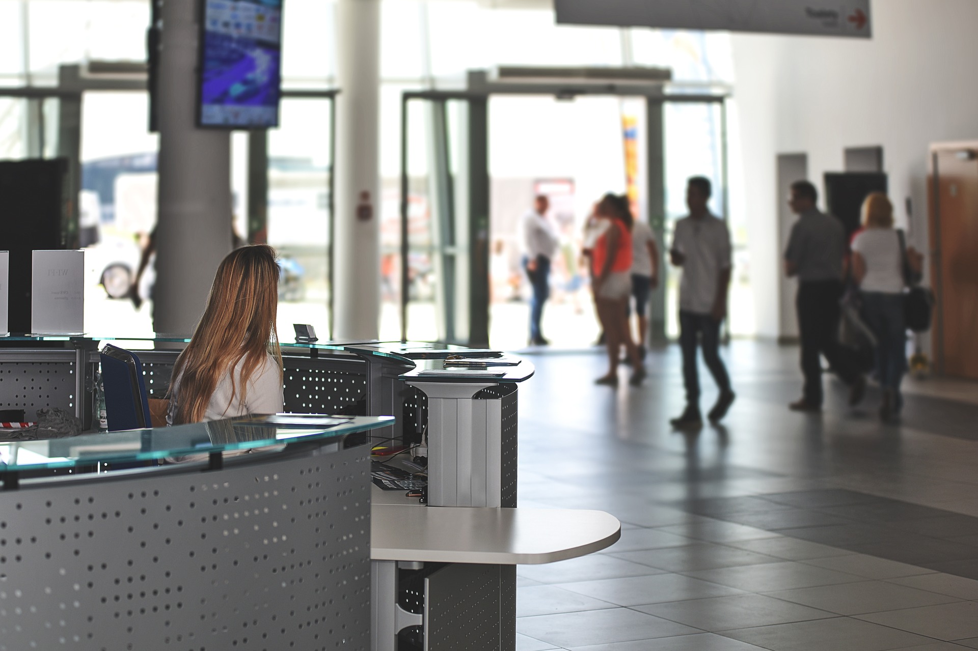 Hotel lobby with reception in the foreground