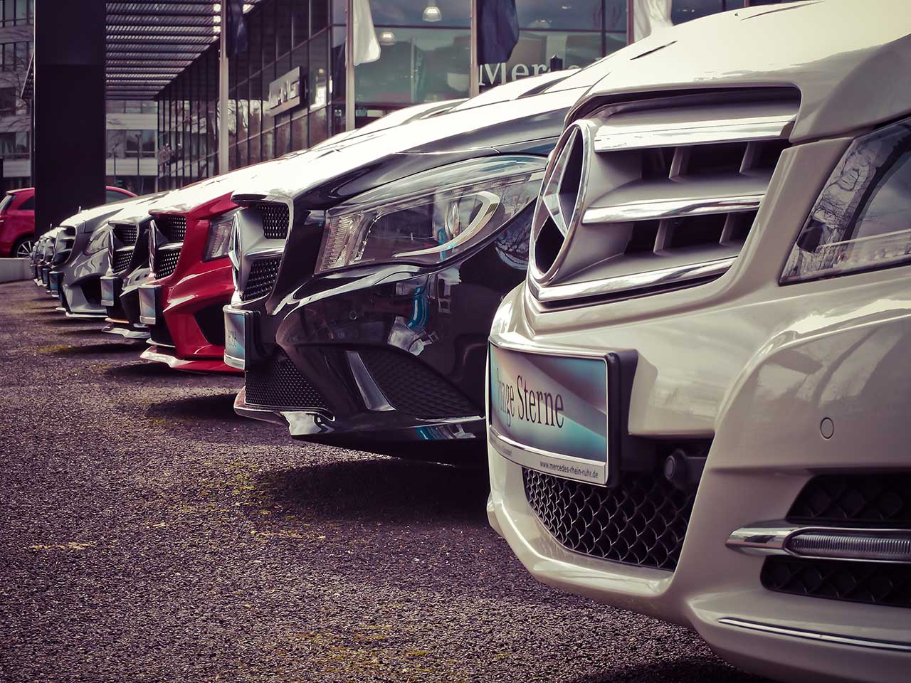 Detail of car bonnets arranged in a row