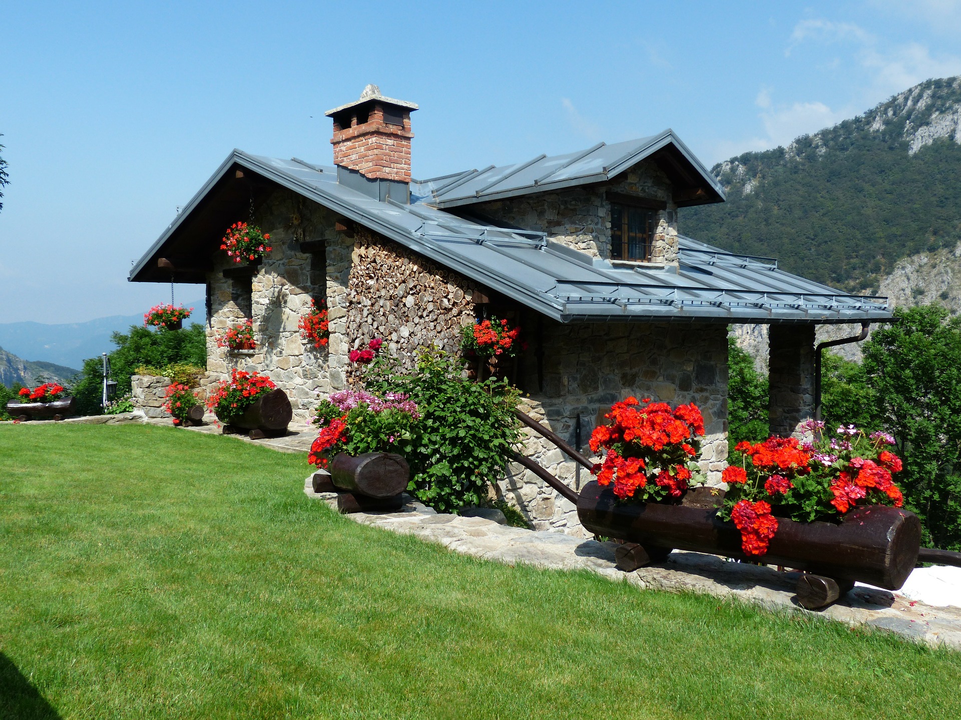 Pretty mountain house with flowers