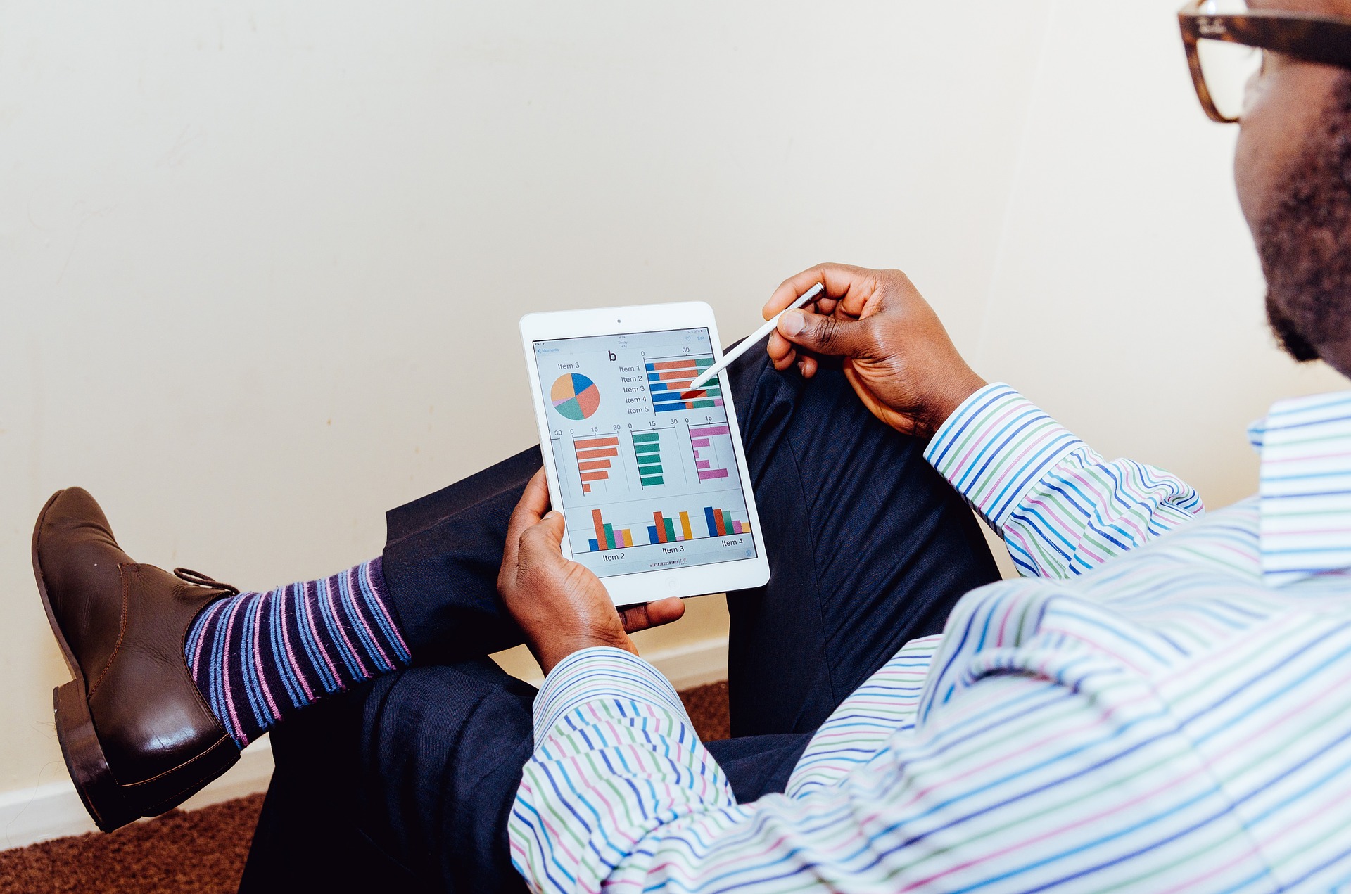 Man consults graphs on a tablet