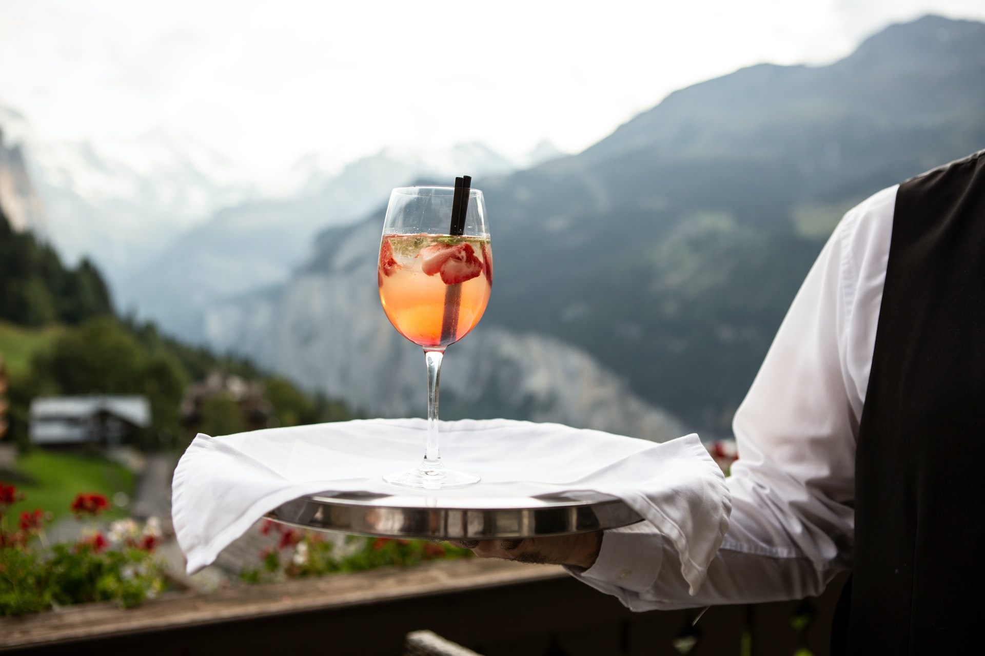 Waiter brings a spritz to the tray